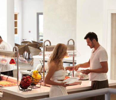 Couple getting pizza from buffet at St. Elias Lemon tree restaurant
