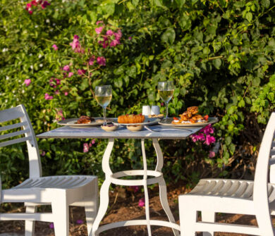 Table with traditional food , spreads and wine at Louis St, Elias Meze restaurant