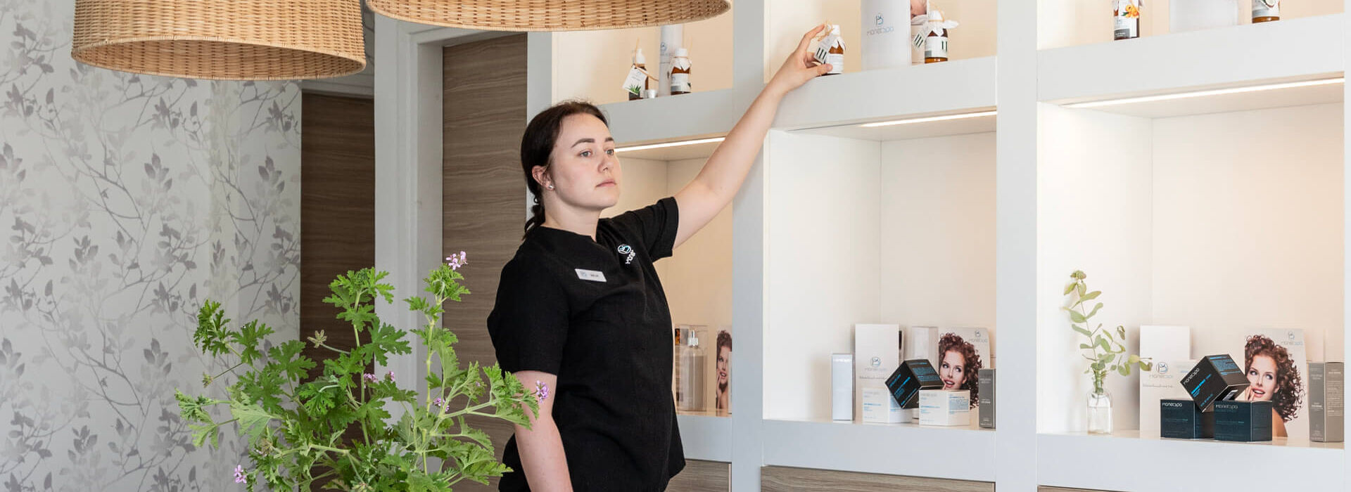 Spa personnel organizing oils at Louis St. Elias Spa