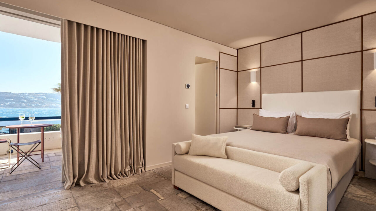 Mykonos Theoxenia Classic room with sea view bedroom with couch and balcony
