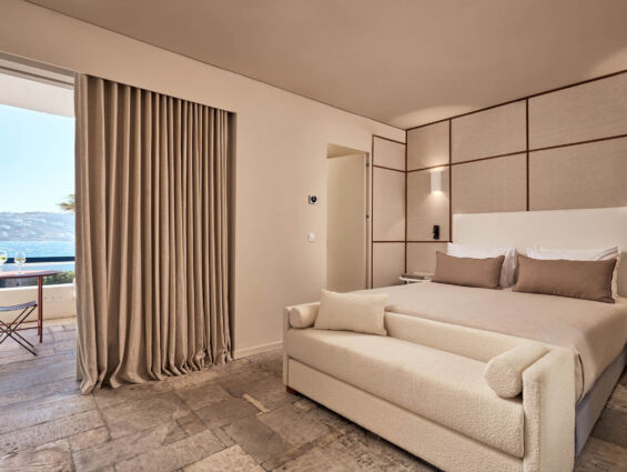 Mykonos Theoxenia Classic room with sea view bedroom with couch and balcony