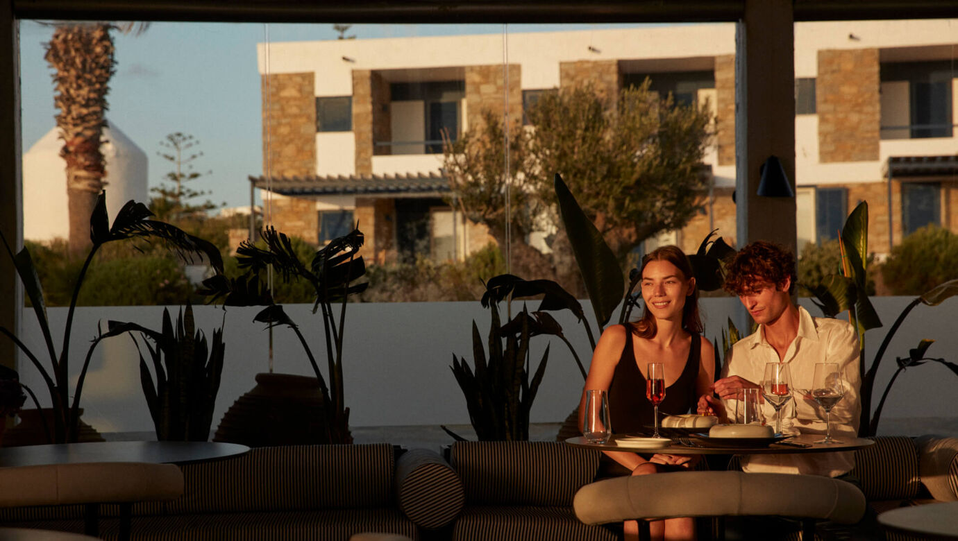 Couple drinking wine at Mykonos Theoxenia bar