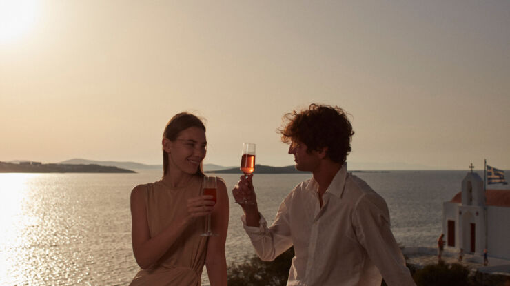 Couple drinking wine watching the sunset