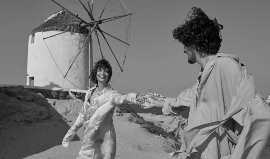 Couple laughing near windmills