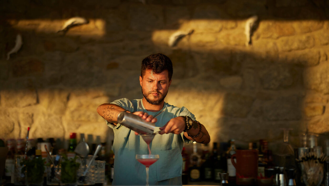 Barman preparing cocktail at Once In Mykonos bar