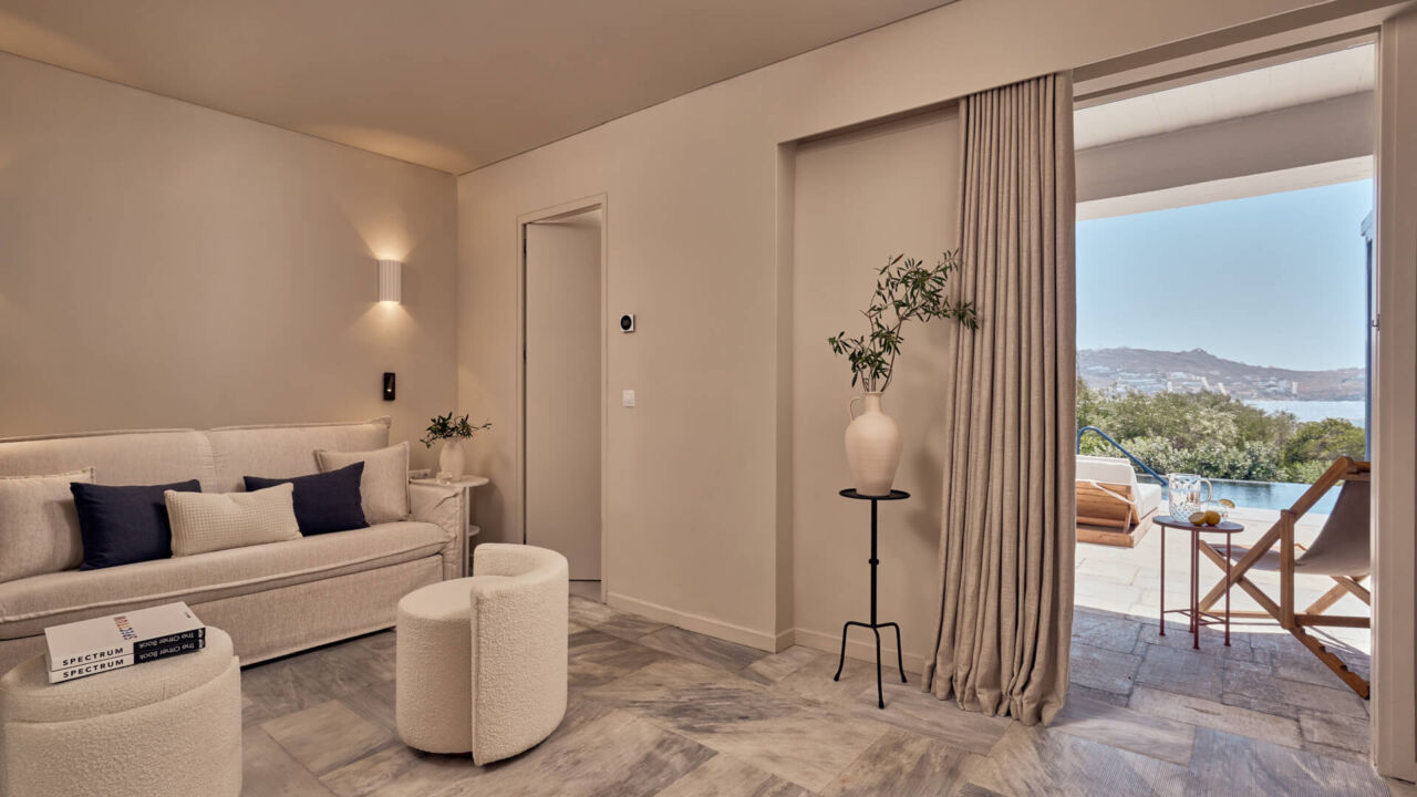 Mykonos Theoxenia room with sitting area, balcony with pool
