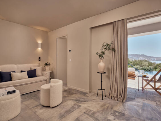 Mykonos Theoxenia room with sitting area, balcony with pool
