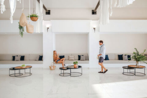 Man walking through the lounge area of Louis Paphos Breeze