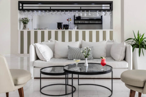 Bar sitting area with couch at Louis Paphos Breeze