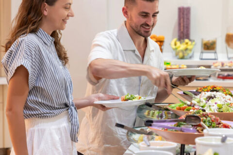 Couple eating at a buffet in Louis Paphos Breeze restaurant