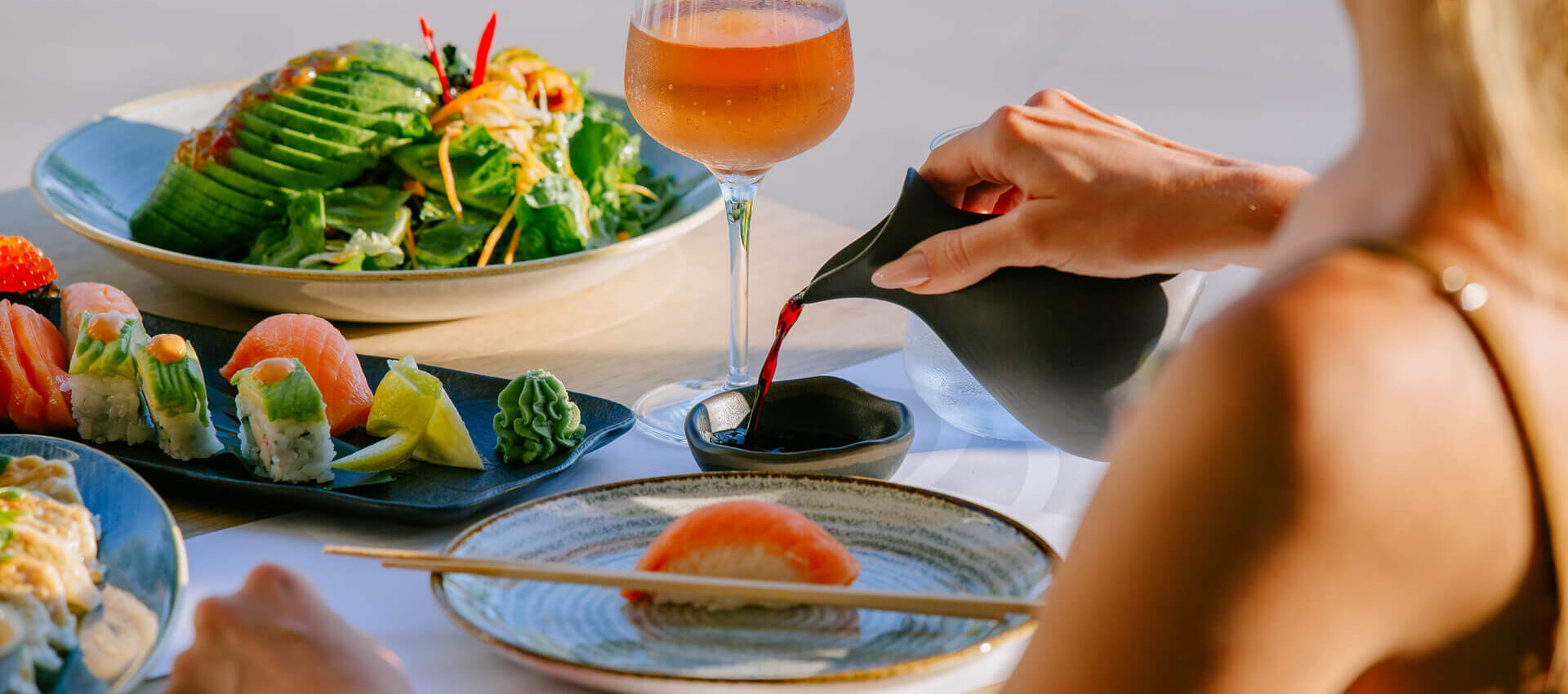 Woman eating at Ivi Mare Fiki restaurant
