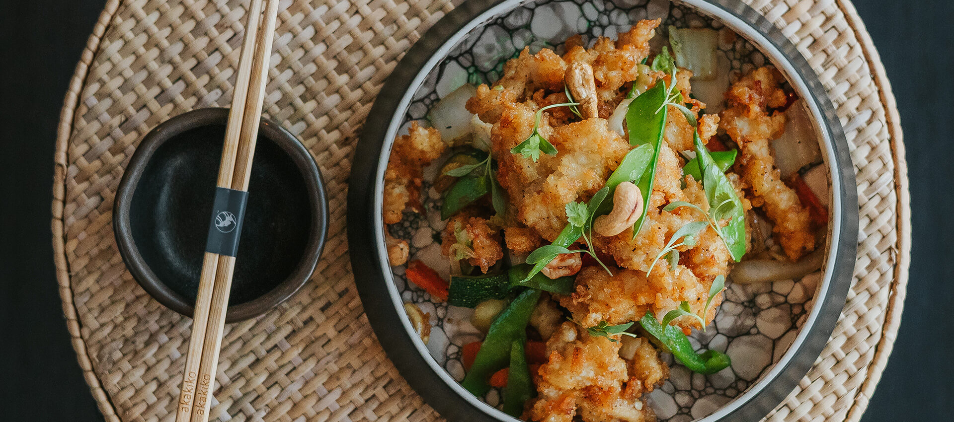 Crispy fried seafood with vegetables and chopsticks