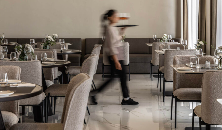 Waitress with drinks in Cali Hotel restaurant