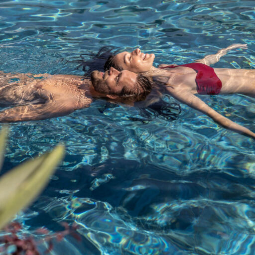 Couple floating in a swimming pool