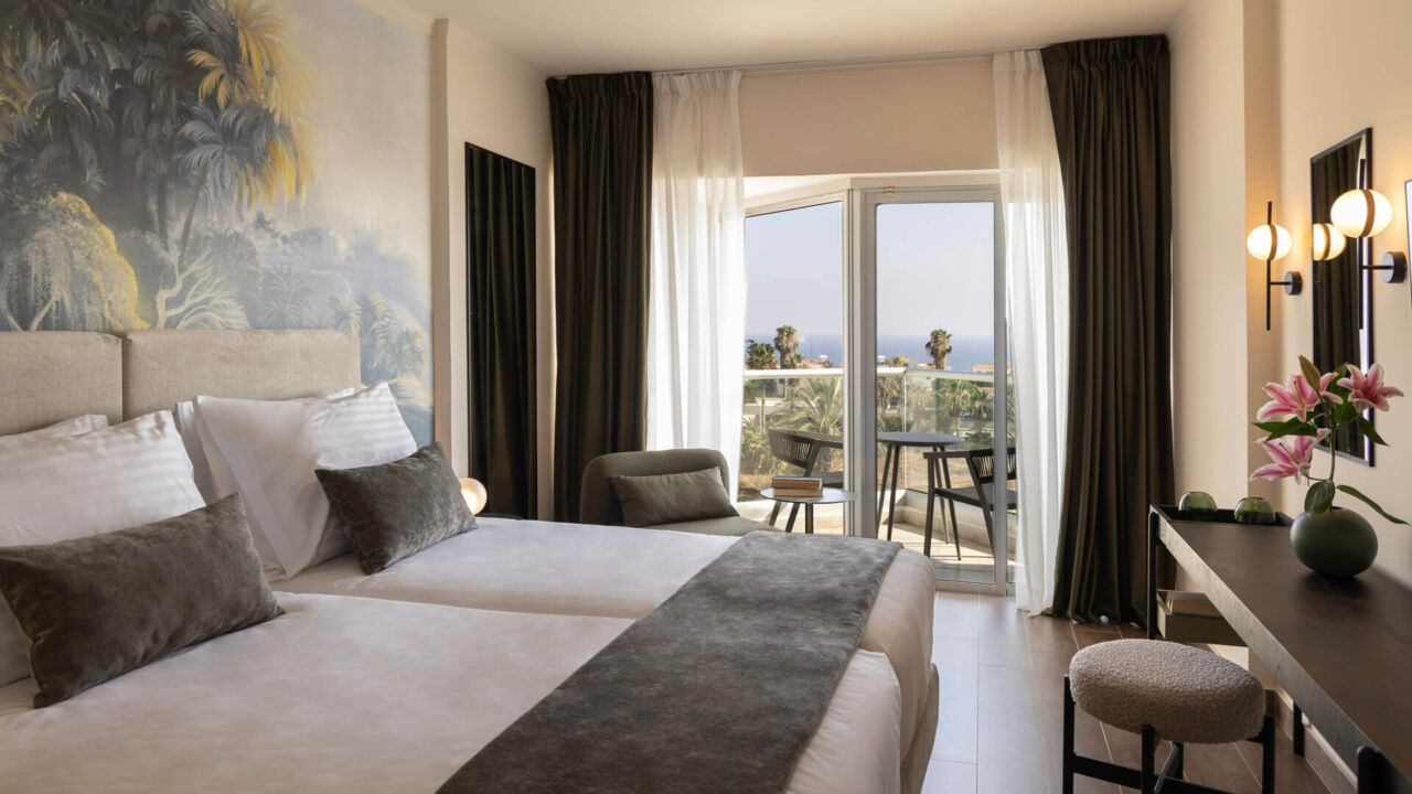 Cali Resort Superior room with Side Sea View bedroom