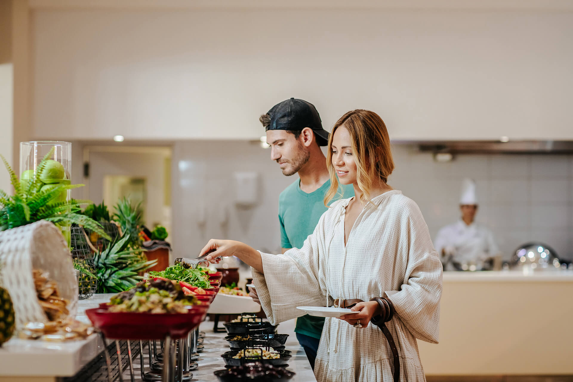 Couple taking food from the buffet at Paphos Rigani Restaurant