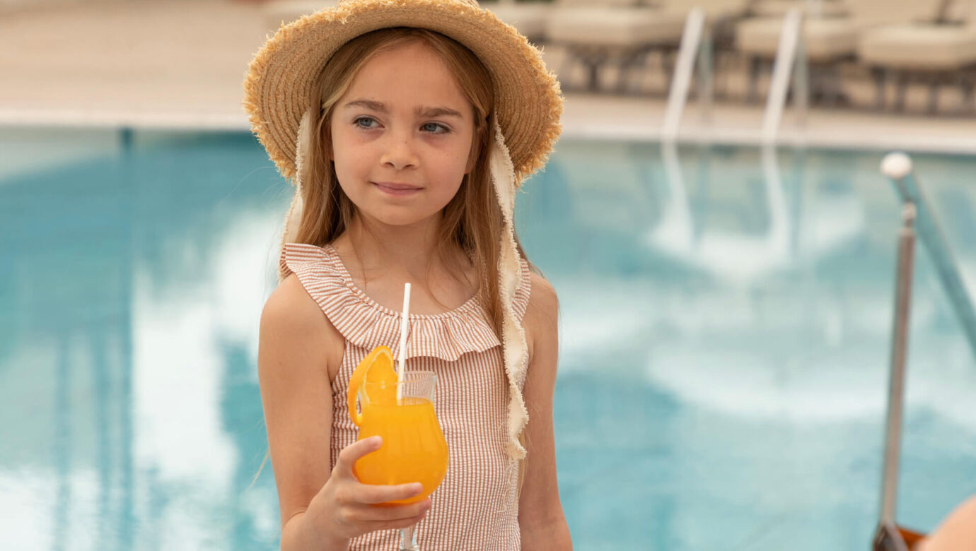 Children drinking orange juice at paphos thymari restaurant