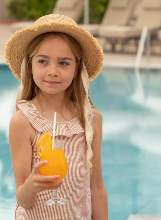 Children drinking orange juice at paphos thymari restaurant