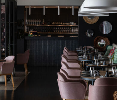 Royal Apollonia Akakiko Restaurant indoor space tables and couch