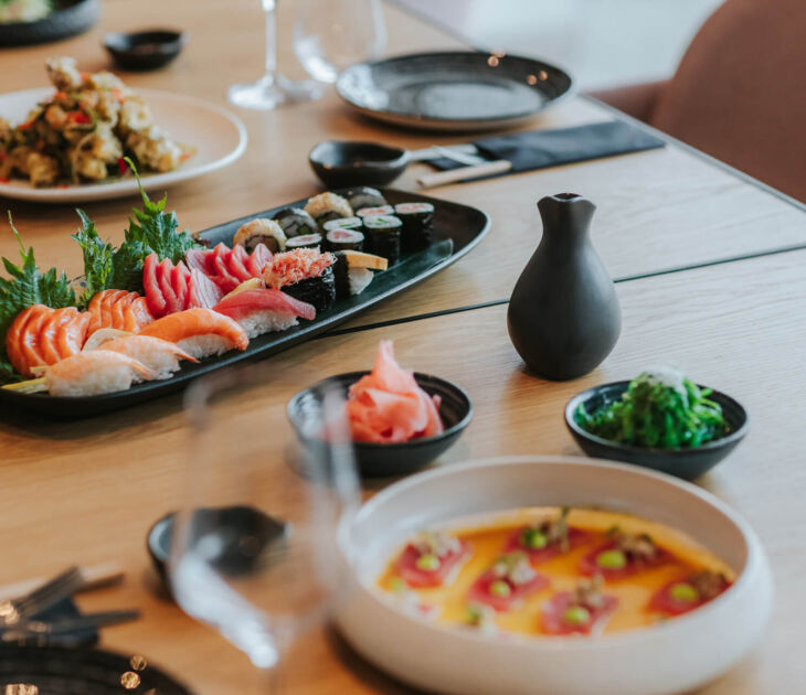 Table served with sushi and Asian food at Royal Apollonia restaurant