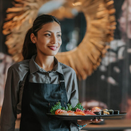 Waiter serving sushi at Royal Apollonia restaurant