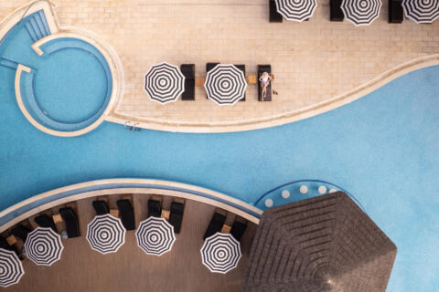 Woman sunbathing at Royal Apollonia pool