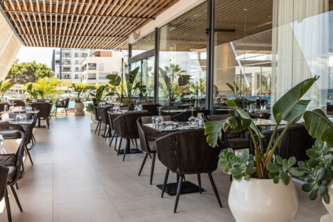 Outdoor tables ready for dinner at Royal Apollonia