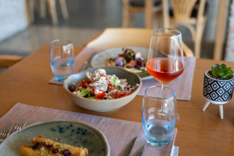 Tradionial salad served with wine at Royal Apollonia