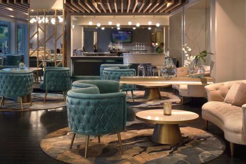 Royal Apollonia Lounge bar indoor space with couch and sofas