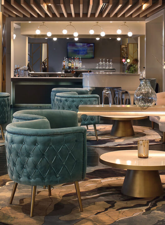 Royal Apollonia Lounge bar indoor space with couch and sofas