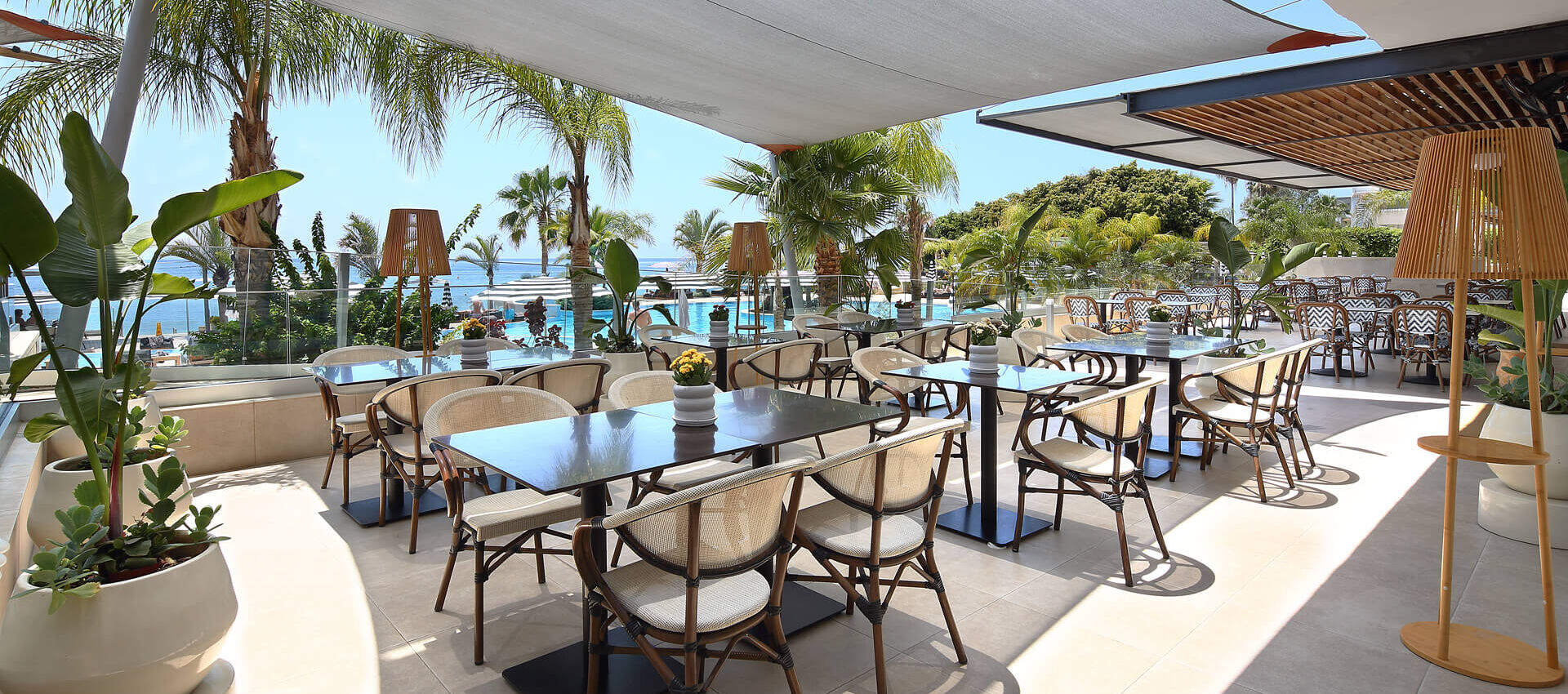 Outdoor tables and chair at Royal Apollonia lounge bar