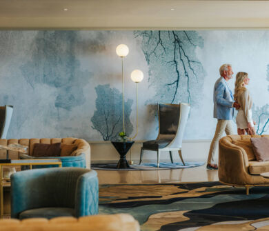 Couple walking through lounge area at Royal Apollonia