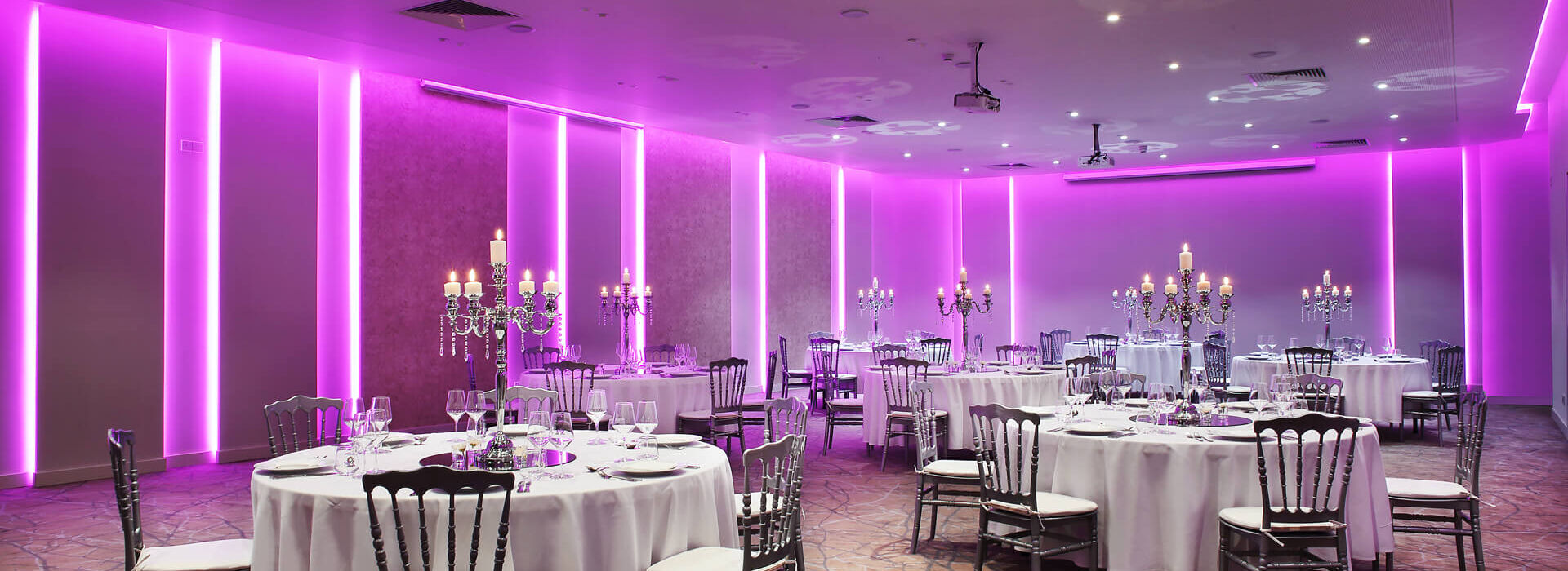 Royal Apollonia meeting hall with tables and formal decorations