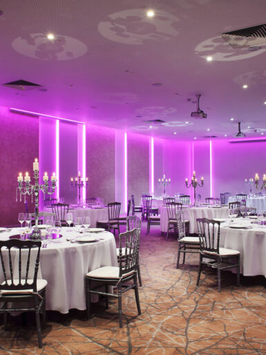 Royal Apollonia meeting hall with tables and formal decorations