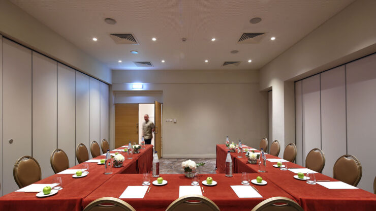 Royal Apollonia meeting table with chairs , water and fruit