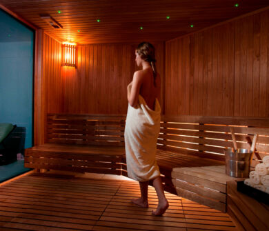 Woman walking in Royal Apollonia Wooden sauna