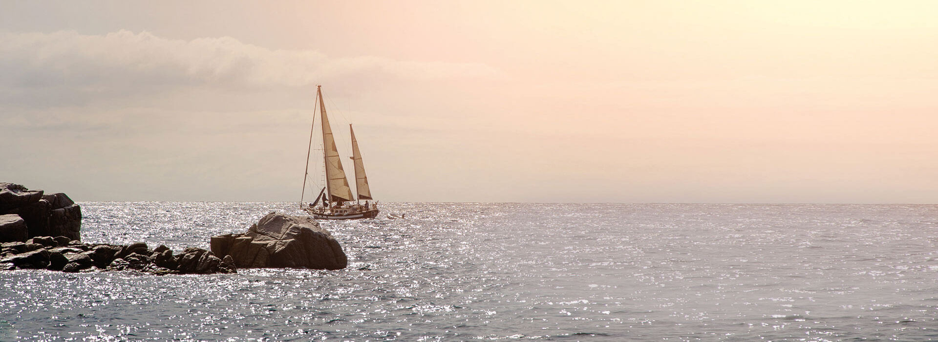 Sailing boat on Mediterranean sea at sunset