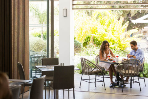 Couple eating at Sofianna Resort Mesogios A la Carte Restaurant