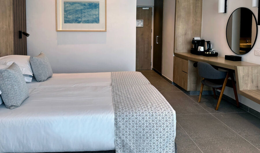 Premium Room Bedroom sitting area and Bed