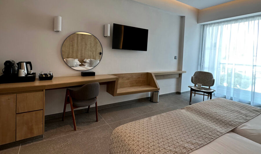 Premium Room Bedroom sitting area and Bed and balcony