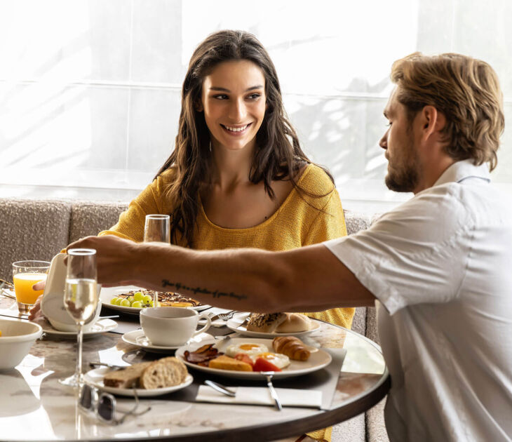 Couple enjoying breakfast at Cali Resort & Spa