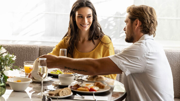 Couple enjoying breakfast at Cali Resort & Spa