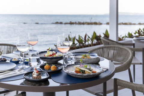Valmar Corfu table with well prepared food and wine