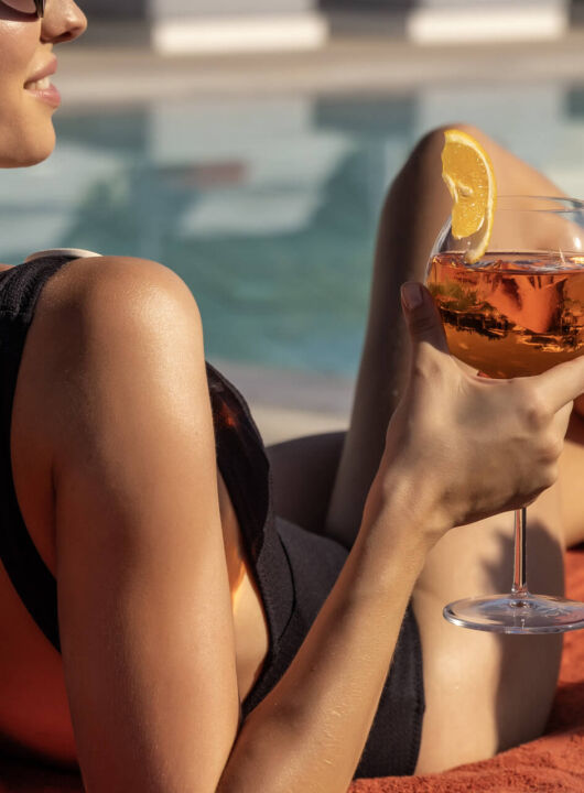 Woman drinking wine at Valmar Corfu Monte bar