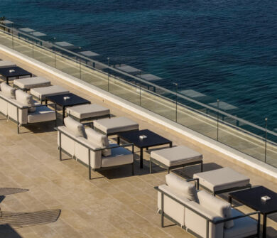 Rooftop tables and couch at tarazza restaurant at Valmar Corfu