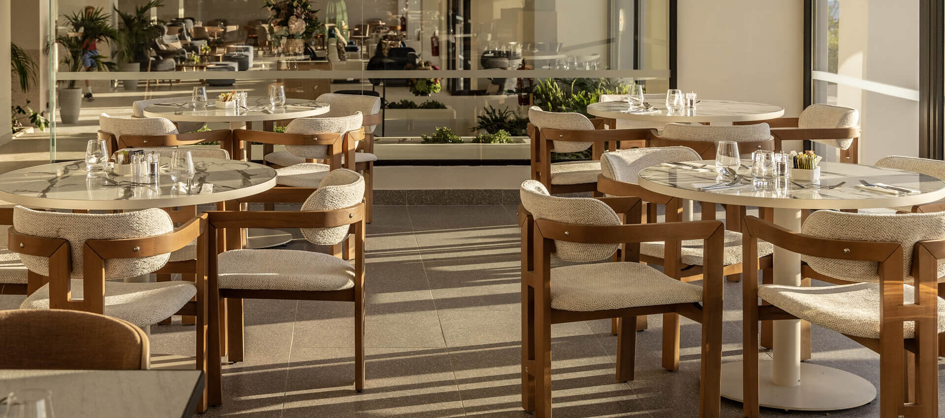 Tables prepared for lunch at Valmar Corfu Valle restaurant