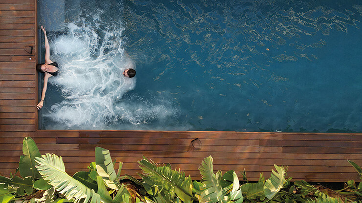 Couple in luxury pool villa