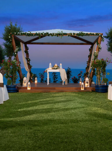 Elegant outdoor venue prepared for a vow renewal ceremony at sunset